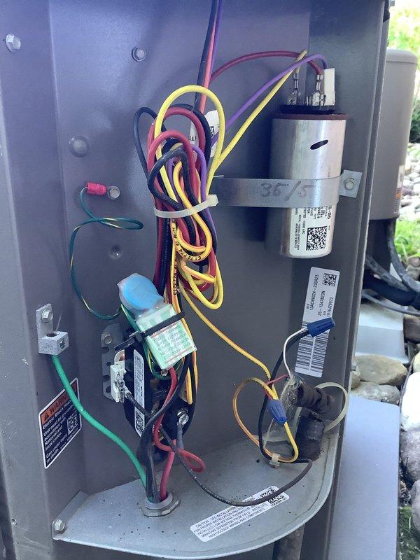 Completed annual air conditioning maintenance on a Lennox outdoor condenser unit over ten years old and accessed the attic-mounted upstairs air handler system. Performed comprehensive inspection of electrical components including capacitor, relay, and control wiring, verified all connections were secure, checked refrigerant levels, cleaned condenser coils, and confirmed proper system operation for both indoor and outdoor units.