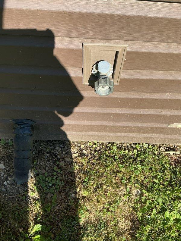 Replaced outdated exterior spigot on 1950s-era home, requiring access through existing wall panel to disconnect old fixture and install new frost-free hose bib with proper sealing and weatherproofing. Verified secure mounting and tested for leaks to ensure reliable outdoor water access.
