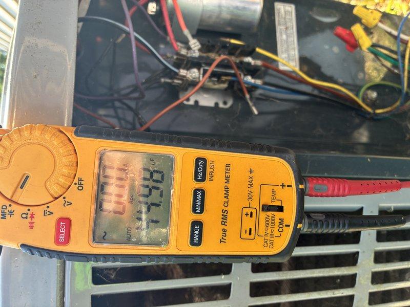 Completed scheduled maintenance visit on residential cooling system. Performed diagnostic testing using digital multimeter, recording voltage reading of 7.59 volts at control circuit. Inspected and replaced dual electrical fuses in disconnect box due to wear and discoloration on copper end caps. Verified all electrical connections, tested capacitor functionality, and confirmed proper system operation upon completion.
