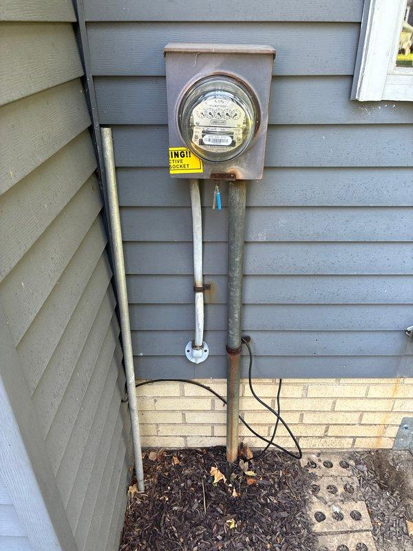 Responded to service call for electrical issue affecting air conditioning system. Upon arrival, performed comprehensive evaluation of electrical infrastructure serving the AC unit. Inspection revealed compromised wiring connections within junction box mounted in structural framing. Found multiple conductors requiring proper termination and securing. Rewired junction box connections using appropriate wire nuts, ensuring all hot, neutral, and ground conductors were properly terminated per NEC standards. Secured all wiring with cable management devices to prevent future strain or disconnection.

External inspection of electrical service revealed meter base and associated conduit system showing signs of age and weathering. Verified proper grounding and bonding at service entrance. Confirmed metallic conduit integrity despite surface corrosion. Tested all connections at meter base to ensure secure termination of service conductors. Verified proper operation of electrical service feeding AC 