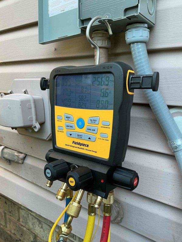 Completed preventive maintenance inspection on Lennox air conditioning condenser unit. Connected Fieldpiece digital manifold gauges to measure refrigerant pressures and system performance parameters, verifying proper operating conditions and refrigerant charge levels. All system diagnostics indicated normal operation with no issues identified during the routine maintenance visit.