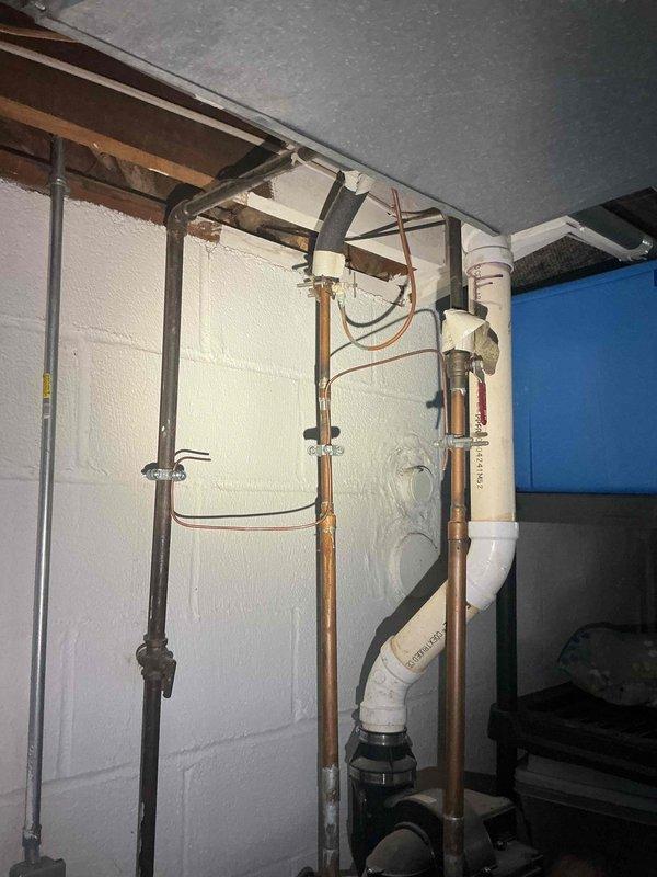 Installed new GFCI outlet in basement utility area, troubleshot and repaired non-functioning GFCI outlet in kitchen, and installed proper grounding for electrical line near water heater to bring property into compliance with inspection requirements for sale.