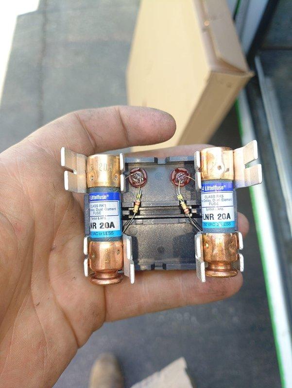 Completed installation of new air conditioning system with matching evaporator coil. Installed dual-element fuse disconnect with Littelfuse Class RK5 20-amp fuses for proper electrical protection. Connected refrigerant lines to outdoor condensing unit with proper insulation on suction line, verified all valve connections and brazed joints for leak-free operation, and set unit on composite pad with proper drainage substrate.