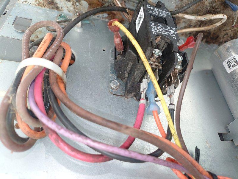 Responded to no-cooling call on a unit less than two years old. Upon arrival, verified system would not start despite customer confirming thermostat settings and fuse were operational. Inspection revealed failed contactor with severely corroded contacts and evidence of moisture intrusion causing premature component failure. Replaced defective contactor, verified all electrical connections, tested system operation, and confirmed unit now cooling properly with normal amperage draw.