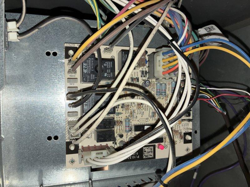 Completed annual cooling system maintenance on a ten-year-old air conditioning unit. Performed comprehensive inspection of all major components including the control board, electrical connections, and zone damper system. Verified proper operation of the Honeywell motorized damper control and confirmed all wiring connections were secure and free from deterioration. Inspected the main control board assembly, checking all relays, capacitors, and wire harnesses for signs of wear or damage. All electrical connections, including multi-colored wire bundles and terminal points, were found to be in good working condition with no visible corrosion or loose connections. System tested and operating within normal parameters.