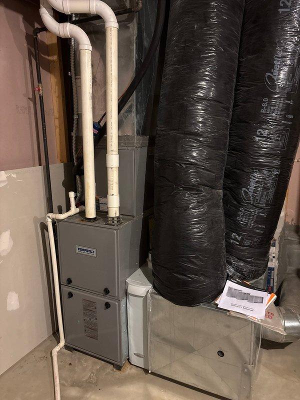 Completed full HVAC system installation including a new Tempstar 90% efficiency furnace and 410A refrigerant air conditioning system in basement mechanical room. Installed complete ductwork configuration with insulated flex ducts, air handler cabinet with filtration system, and proper PVC venting for high-efficiency furnace operation. Installed Kidde carbon monoxide alarm in mechanical room for safety compliance, tested all equipment for proper operation, and verified system functionality upon completion.