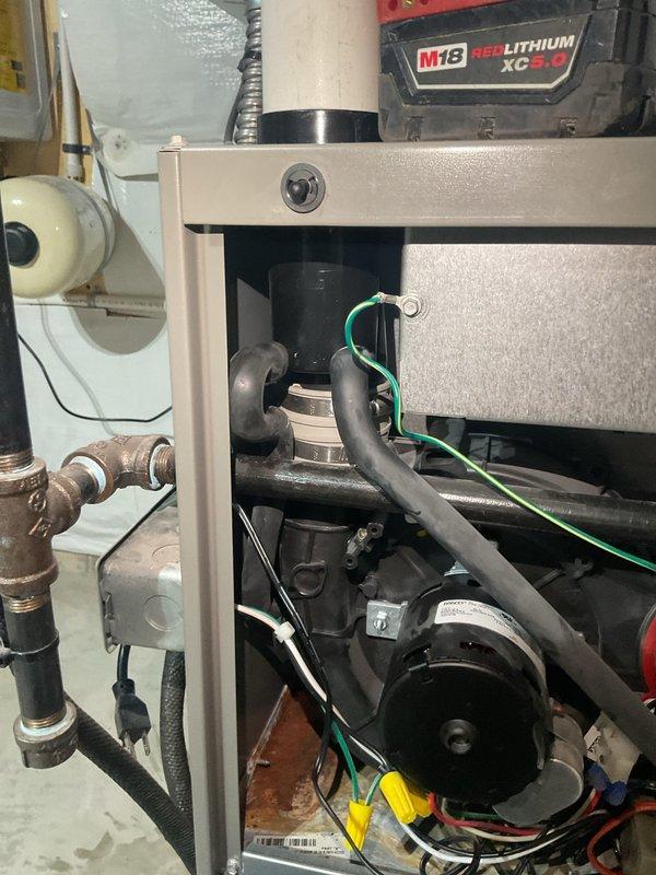 Replaced defective draft inducer motor and installed new external drain trap kit on HVAC system. Parts were ordered and received at shop, then installed upon arrival of all components including condensate trap assembly and drainage hose. System tested and operational following completion of repairs.