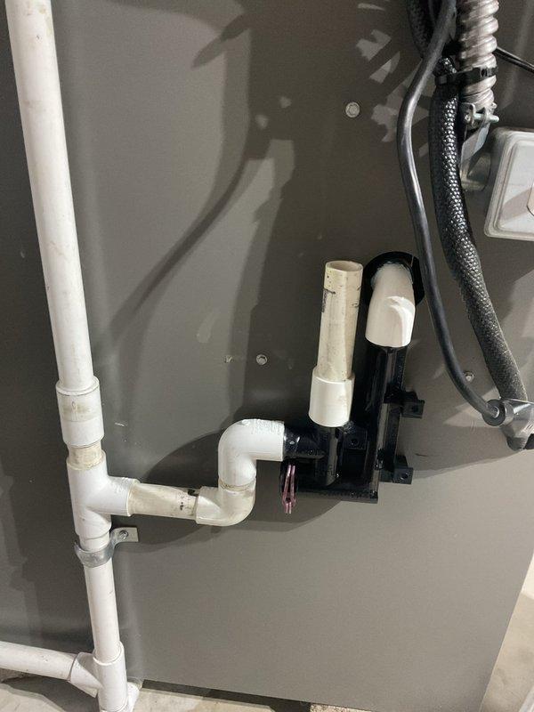 Replaced defective draft inducer motor and installed new external drain trap kit on HVAC system. Parts were ordered and received at shop, then installed upon arrival of all components including condensate trap assembly and drainage hose. System tested and operational following completion of repairs.
