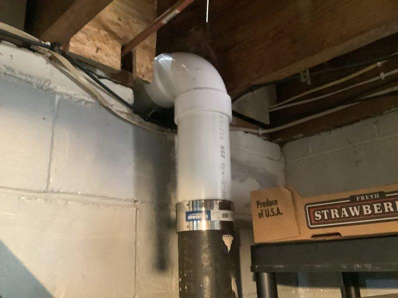 Removed existing water heater and installed new Bradford White 50-gallon electric water heater in basement utility area. Brought installation up to current code requirements by properly bonding the unit and installing a thermal expansion tank with copper piping connections. Verified existing shut-off valve was in working condition and incorporated into new installation. Registered the new unit with manufacturer upon completion.

Performed toilet flange replacement by cutting out deteriorated section of cast iron drain line in basement and installing new PVC piping with proper tie-in points to existing drainage system. Secured new toilet flange to repaired subfloor, preparing area for future toilet installation. All plumbing connections tested and verified for proper operation and code compliance.
