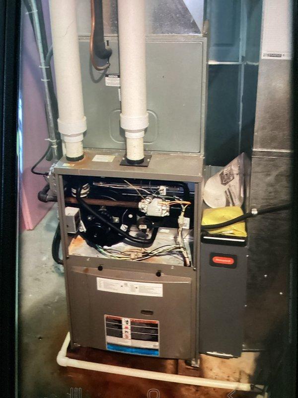Responded to service call for clogged AC discharge line. Upon inspection, cleared obstruction from condensate drain system to restore proper drainage from evaporator coil. Verified system operation and confirmed condensate flowing freely through drain line upon completion.