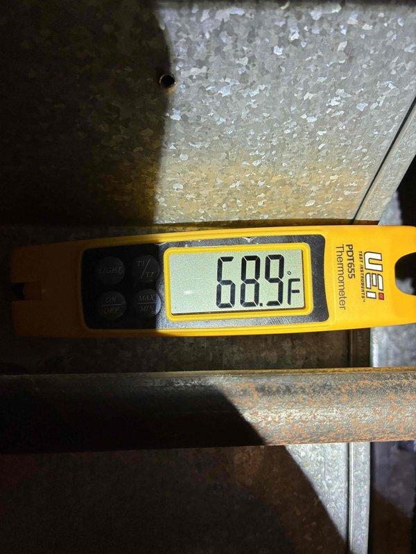 Performed routine maintenance on a 2-year-old residential air conditioning system. Inspected outdoor condenser unit, verified proper operation, and measured supply air temperature at 68.9°F using calibrated infrared thermometer. Condenser coils showed minor accumulation of debris but remained within acceptable operating parameters. All components functioning normally with no immediate service needs identified.