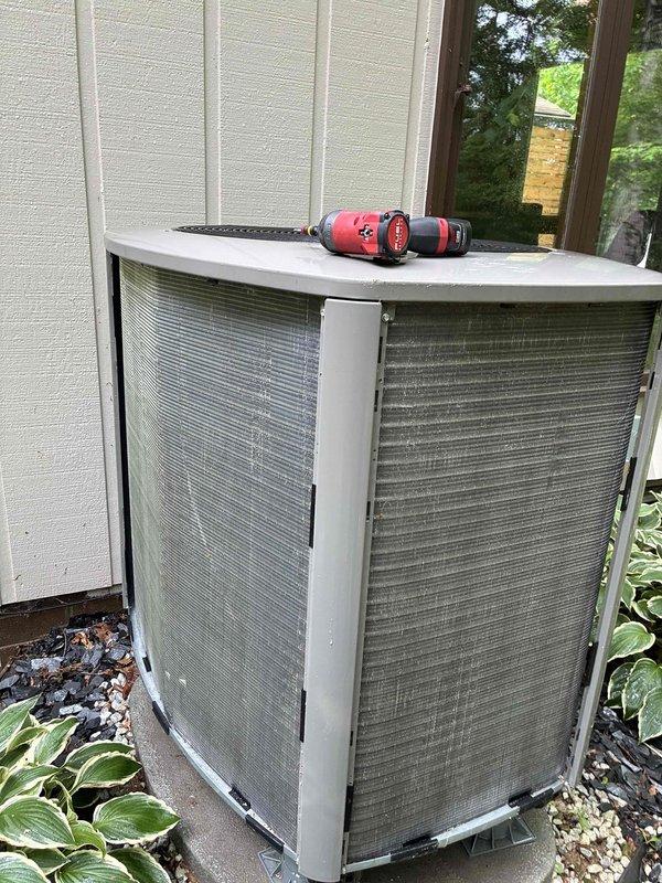 Performed routine maintenance on a 2-year-old residential air conditioning system. Inspected outdoor condenser unit, verified proper operation, and measured supply air temperature at 68.9°F using calibrated infrared thermometer. Condenser coils showed minor accumulation of debris but remained within acceptable operating parameters. All components functioning normally with no immediate service needs identified.