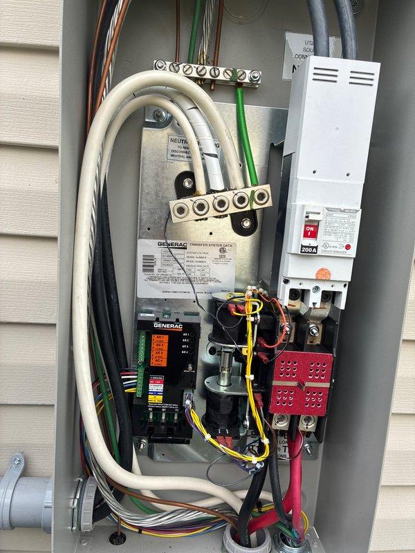 # Electrical Maintenance - Generator

Performed comprehensive preventive maintenance on a 14kW Generac residential backup power system with automatic transfer switch rated at 200 amps, 240 volts. Conducted thorough inspection of the transfer switch panel, control module, and all associated electrical connections, verifying proper operation of all indicator lights and system components. Documented the installation condition through detailed photography, confirming all grounding connections, wire management, and safety systems are secure and functioning within manufacturer specifications.