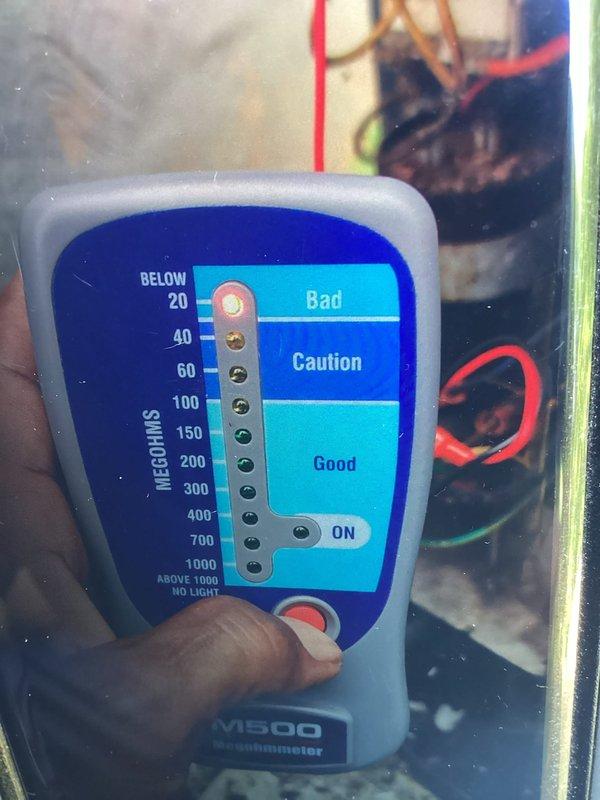 Responded to no cooling call on 10-year-old air conditioning system. Upon inspection, discovered failed contactor with severe electrical damage, including burned and melted housing, corroded contacts, and evidence of overheating. Performed insulation resistance test using megohmmeter which confirmed electrical failure reading in the "bad" range. Replaced damaged contactor and restored system to proper operation.