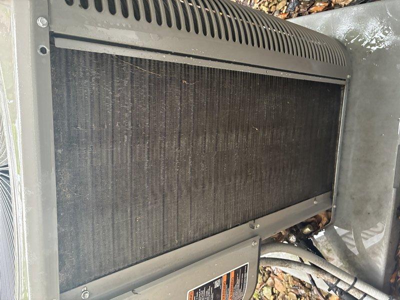 Completed comprehensive cooling system maintenance on a five-year-old air conditioning unit. Performed standard tune-up procedures including inspection of the outdoor condenser unit, evaluated heat exchanger and evaporator coil assembly condition, and assessed airflow through the finned panels. Unit showed normal wear with minor dirt accumulation on condenser screen and mesh surfaces; all components functioning within acceptable parameters for continued operation.