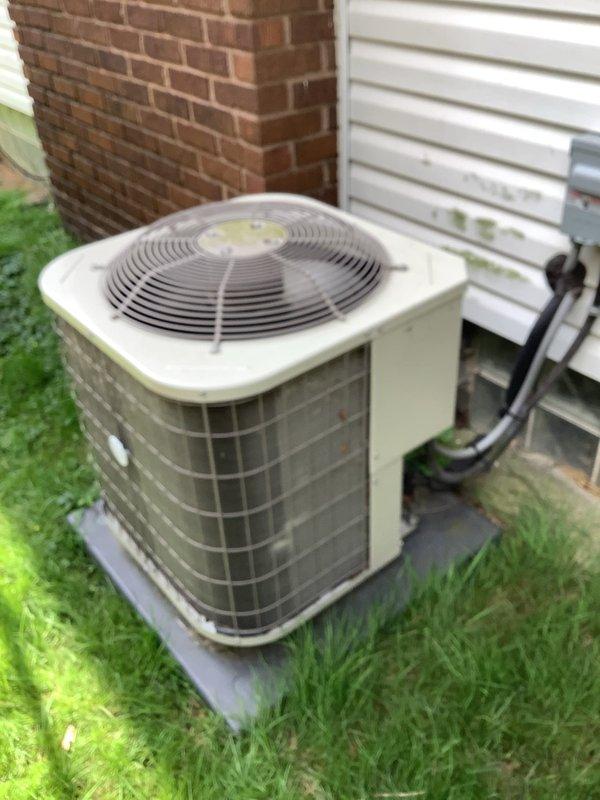 Responded to service call for insufficient cooling on central air conditioning system. Customer reported thermostat set to 68°F but indoor temperature reading 77°F, with system running continuously and cold air felt at furnace but inadequate cooling to main floor and upstairs. Inspected outdoor condenser unit, a 2017 Carrier CNPVP3014ALAAAAA model utilizing R-410A refrigerant, and verified unit operation. Documented equipment condition and specifications for service records.