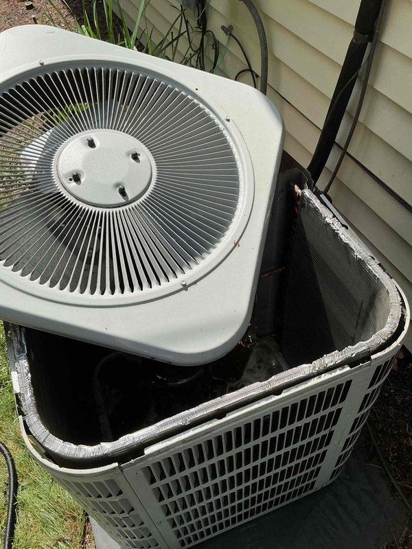 Completed routine HVAC maintenance visit for MVP customer with dual outdoor condenser units. Performed comprehensive system inspection including examination of both white and dark-colored condenser units positioned at building exterior, verified operational status of equipment, and inspected interior air handling components including ductwork, insulation integrity, and plenum accessibility. All systems assessed and documented with photographic records for service history.