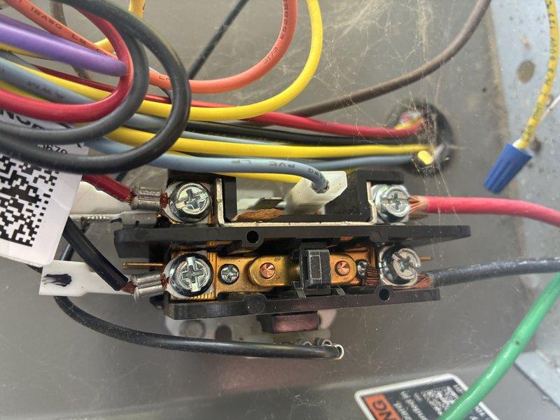 Performed preventive maintenance on a seven-year-old air conditioning system, including inspection of electrical connections at the terminal block where multiple control wires showed age-related discoloration and minor oxidation on brass terminals. Verified proper airflow through the return air grille and confirmed all louvers were functioning correctly with adequate clearance for system operation.