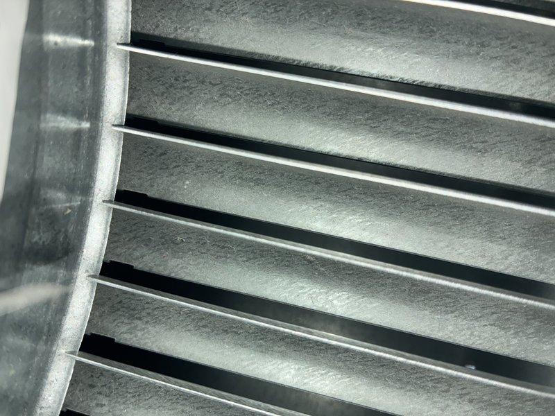 Performed preventive maintenance on a seven-year-old air conditioning system, including inspection of electrical connections at the terminal block where multiple control wires showed age-related discoloration and minor oxidation on brass terminals. Verified proper airflow through the return air grille and confirmed all louvers were functioning correctly with adequate clearance for system operation.