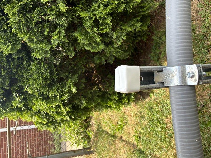 Completed warranty work following failed inspection by capping off exterior electrical post and securing flexible metallic conduit with proper mounting brackets and clamps. Installed white cushioned spacers on metal mounting hardware to ensure proper support and protection of conduit run across outdoor terrain. Delivered generator keys to customer upon completion of corrective work.