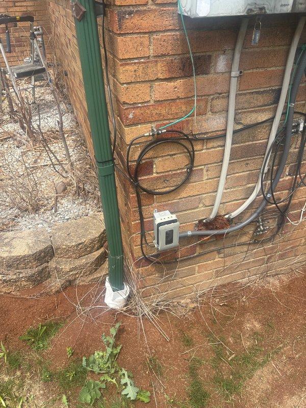 Installed four outdoor security cameras and two outdoor area lights on the exterior of a brick residential structure. Three cameras utilized existing wiring infrastructure, while one camera required rewiring to ensure proper placement and functionality. All electrical connections were made to code, conduit runs were secured to the brick facade, and fixtures were tested for proper operation upon completion.
