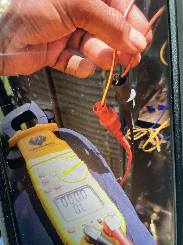 Responded to no cooling complaint on 10-year-old air conditioning system. Performed electrical diagnostics at outdoor unit using digital multimeter to verify proper voltage and component operation. Inspection revealed significantly dirty evaporator coil with heavy dust and debris accumulation restricting airflow. The contaminated coil condition was identified as primary cause of reduced cooling capacity and system performance issues.