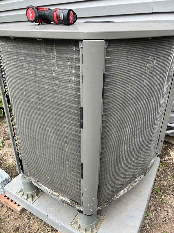 Completed MVP recurring cooling maintenance visit on 4-year-old residential split-system air conditioning unit. Performed comprehensive inspection of outdoor condenser unit, verifying proper operation of compressor and condenser fan motor. Inspected aluminum fin coil surfaces for debris accumulation and airflow restrictions. Opened electrical disconnect panel to examine all electrical connections, contactors, relays, and capacitor. Verified proper wire terminations and checked for signs of overheating or component degradation. Documented equipment condition through photographs showing condenser unit exterior, coil conditions, and internal electrical components. Unit operating within normal parameters with no immediate service needs identified. System ready for continued operation through cooling season.