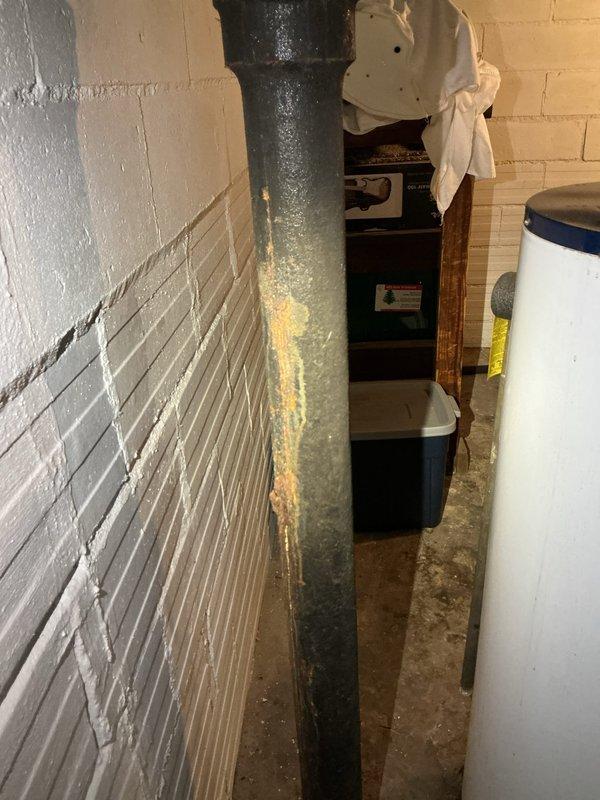Installed a clean out on the main sewer stack in the basement to provide access point for drain clearing equipment. Performed main drain snaking by running cable through the newly installed clean out to the city main connection, successfully clearing blockage in the sewer line. Work completed in basement utility area where main stack is located near water heater and HVAC equipment.