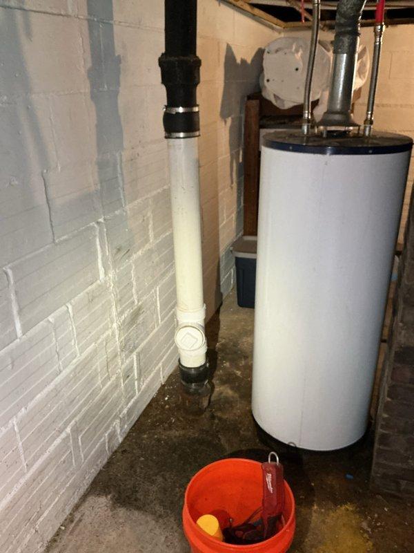 Installed a clean out on the main sewer stack in the basement to provide access point for drain clearing equipment. Performed main drain snaking by running cable through the newly installed clean out to the city main connection, successfully clearing blockage in the sewer line. Work completed in basement utility area where main stack is located near water heater and HVAC equipment.