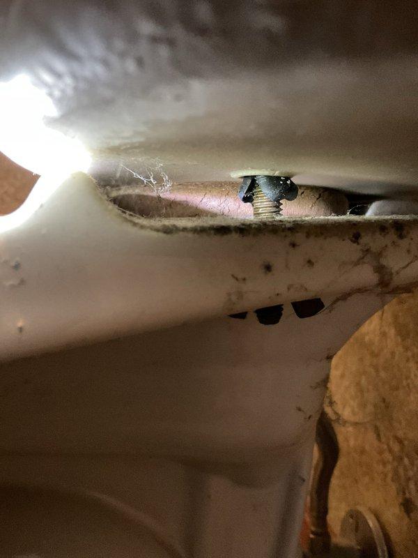 Responded to complaint of continuously running toilet. Upon inspection, found toilet tank fill valve failing to shut off properly, causing constant water flow into overflow tube. Tank interior showed extensive rust staining, mineral deposits, and corroded components affecting flush mechanism performance. Diagnosed faulty fill valve assembly and worn flapper valve as primary causes of running condition. Documented existing corrosion and deterioration of internal tank components for repair recommendations.