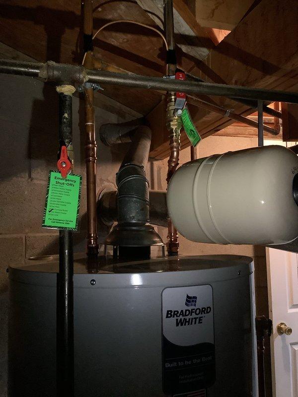 Completed full water heater replacement with Bradford White unit, including installation of new expansion tank with 10-year warranty coverage. Replaced existing water softener system with new standard softener unit and installed whole home filtration system. All copper piping connections were properly soldered, shut-off valves with handles installed for system control, and expansion tank mounted horizontally to optimize available space in utility area. System tested and verified operational upon completion.