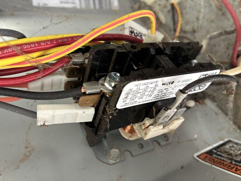 Completed comprehensive AC tune-up including electrical performance testing and component inspection. Measured amperage draw on condenser fan motor using clamp meter, verifying proper operation at 9.2 amps, and confirmed contactor functionality with all wire connections secure and terminals properly tightened.
