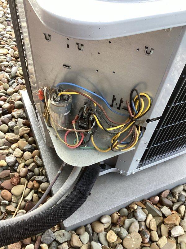 Completed preventative maintenance on residential air conditioning system. Performed thorough inspection of condenser unit electrical components including capacitor, contactor, and wiring connections, verified all terminals properly secured and color-coded wiring intact. Unit found in good operating condition with clean coil fins and proper drainage around concrete pad.
