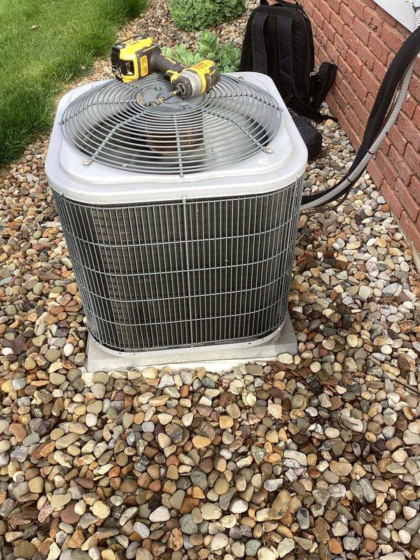 Completed preventative maintenance on residential air conditioning system. Performed thorough inspection of condenser unit electrical components including capacitor, contactor, and wiring connections, verified all terminals properly secured and color-coded wiring intact. Unit found in good operating condition with clean coil fins and proper drainage around concrete pad.