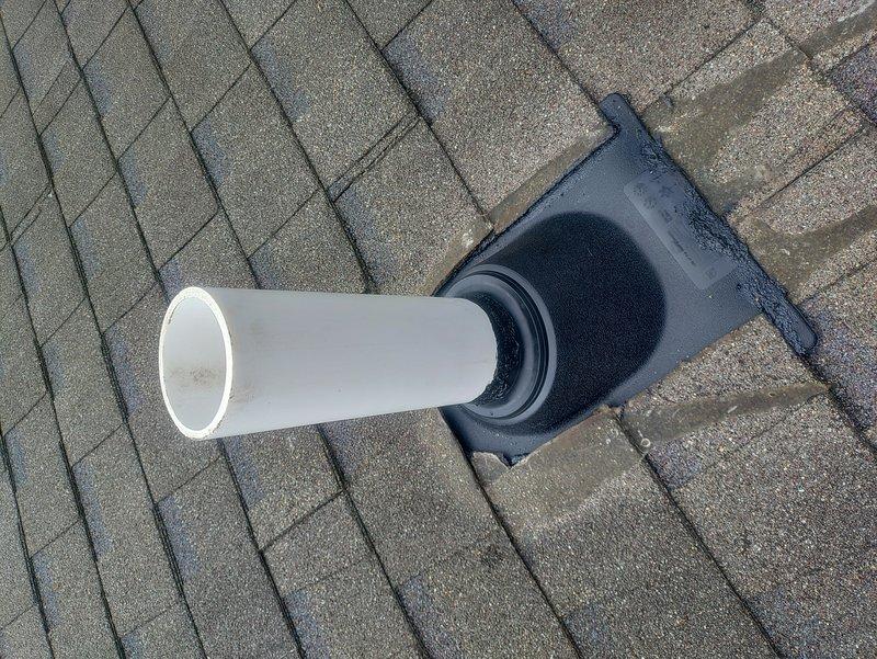 Replaced deteriorated copper vent piping with PVC vent termination through the roof to resolve ongoing water leakage into the bathroom ceiling. Installed new roof flashing boot assembly with proper weatherproofing using roofing caulk to create a watertight seal at the roof penetration point. The copper-to-PVC transition eliminates the corrosion issues evident in the original installation and provides a durable, code-compliant venting solution that addresses the moisture intrusion problem the homeowner experienced over the past year.