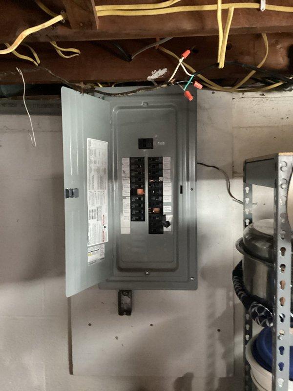 Completed comprehensive electrical upgrade in 60-year-old ranch home, replacing obsolete cloth Romex wiring with modern NM cable throughout three rooms. Installed new circuit breakers in existing panel to accommodate updated circuits, ensuring proper load distribution and code compliance. All connections were tested and verified operational, with panel properly labeled for future reference.