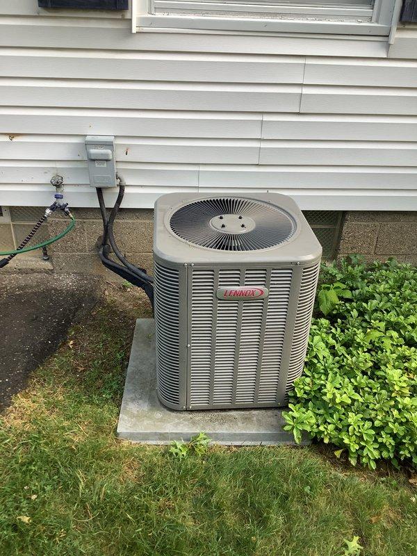 Completed installation of new Lennox air conditioning condenser unit and evaporator coil system. Installed outdoor condensing unit on concrete pad with proper refrigerant line set routing along exterior siding, mounted electrical disconnect box, and connected all necessary electrical components. Inside mechanical room, installed new evaporator coil with air handler integration, completed PVC condensate drain piping system with proper pitch and trap configuration, pressure tested refrigerant lines, evacuated system, charged to manufacturer specifications, and verified proper system operation and airflow.
