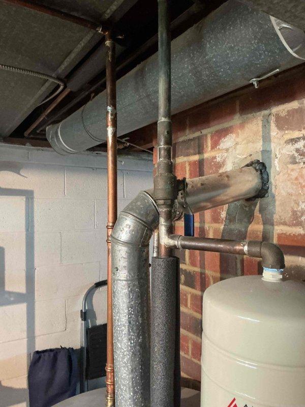 Conducted comprehensive site assessment for standby generator installation at residential property. Evaluated existing electrical infrastructure in basement utility area, documenting current HVAC system configuration including Trane XR condenser unit and mechanical room layout with exposed plumbing, ductwork, and electrical pathways. Assessed optimal generator placement location, existing service panel capacity, and transfer switch installation requirements. Photographed mechanical room conditions, utility routing along masonry walls, and outdoor equipment positioning to develop accurate material list and labor estimate for automatic transfer switch integration and generator system installation.