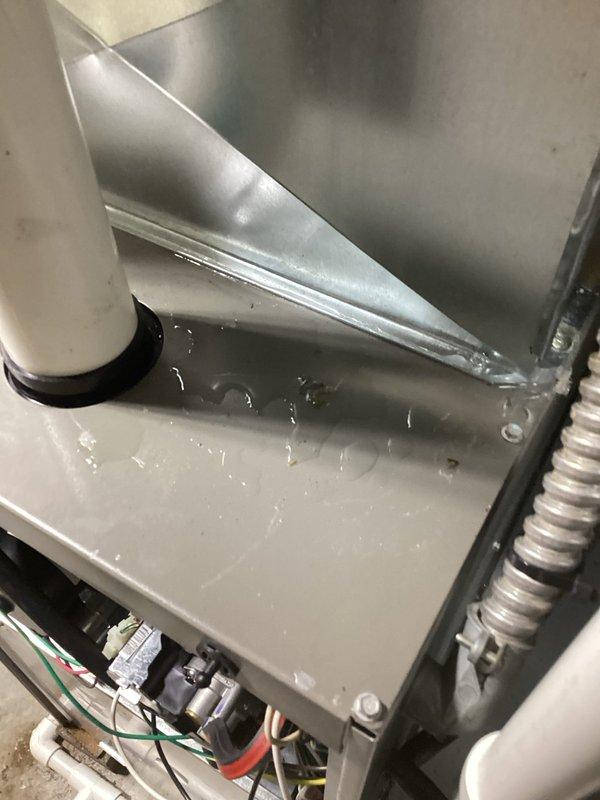 Responded to no cooling complaint on 9-year-old air conditioning system. Upon arrival, confirmed unit had been experiencing ice buildup on evaporator coil, which had been allowed to thaw prior to service visit. Inspection revealed standing water in drain pan, indicating drainage issue. Performed system diagnostics and temperature measurements using calibrated digital instruments. Verified proper system operation after thaw cycle completed. Addressed condensate drainage concerns and confirmed unit returned to normal cooling operation.