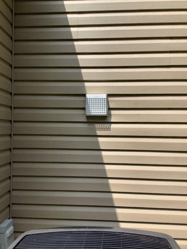 Installed new exhaust fan in interior room with complete ventilation ducting routed through exterior wall to rear of structure, including exterior vent cover with weather-resistant grid design. Replaced existing kitchen light fixture with customer-supplied fixture, ensuring proper electrical connections and mounting. All work completed to code specifications with proper venting and electrical safety standards maintained.