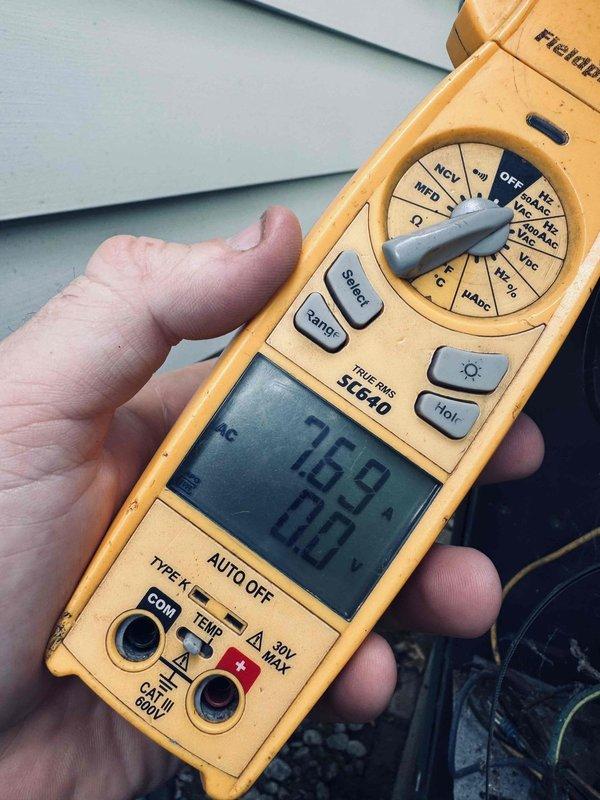 Completed MVP cooling maintenance and identified refrigerant line freezing issue caused by low refrigerant charge. Diagnosed system using clamp meter, which revealed compressor drawing 26.9 amps with 7.8V reading, indicating restricted refrigerant flow. Added refrigerant to proper operating levels, verified system pressures and temperatures returned to normal range, and confirmed ice accumulation dissipated after repair.