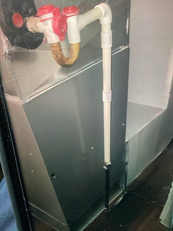 Responded to water leak service call for residential Lennox furnace system. Upon inspection, identified blocked condensate drain line as source of issue. Cleared obstruction from condensate line using appropriate tools and techniques to restore proper drainage flow. Verified condensate trap and PVC drainage piping configuration for proper operation. Tested system operation to confirm condensate was draining freely through trap and drain line without backup or overflow. System returned to normal operation with no further leakage detected.