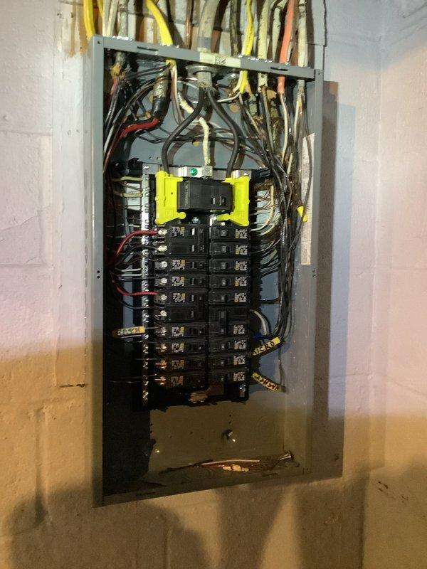 Responded to early morning service call to inspect electrical conduit installation prior to scheduled concrete pour. Performed thorough examination of underground conduit routing in excavated yard area to verify proper depth, protection, and positioning would not be compromised by concrete placement. Conducted comprehensive assessment of residential electrical panel installation, identifying multiple code compliance concerns including improper wire bundling, inadequate cable management at service entrance, and questionable breaker configurations that required attention before drywall installation could proceed.