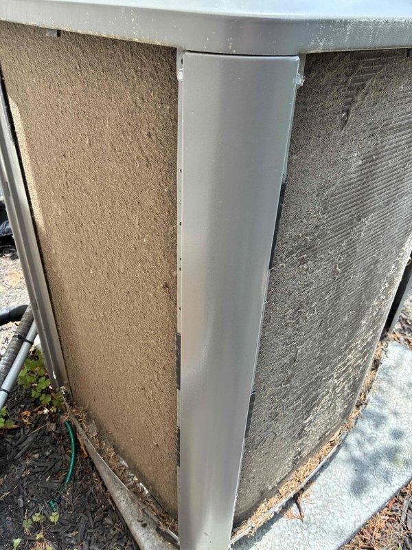 # HVAC Maintenance - Cooling

Completed MVP recurring maintenance visit on a 4-year-old residential air conditioning system. Performed comprehensive inspection of outdoor condenser unit, including examination of cabinet panels, protective grilles, and fan assembly. Unit showed normal operational wear with accumulated dirt, dust, and environmental debris on exterior surfaces and coil fins. Condenser positioned on concrete pad with adequate clearance; noted minor vegetation growth near base and organic debris accumulation on pad surface. Fan motor and blade assembly inspected and found to be operational. Documented current condition of unit exterior panels showing weathering and soiling consistent with outdoor installation. All major components visually assessed for proper operation and structural integrity.