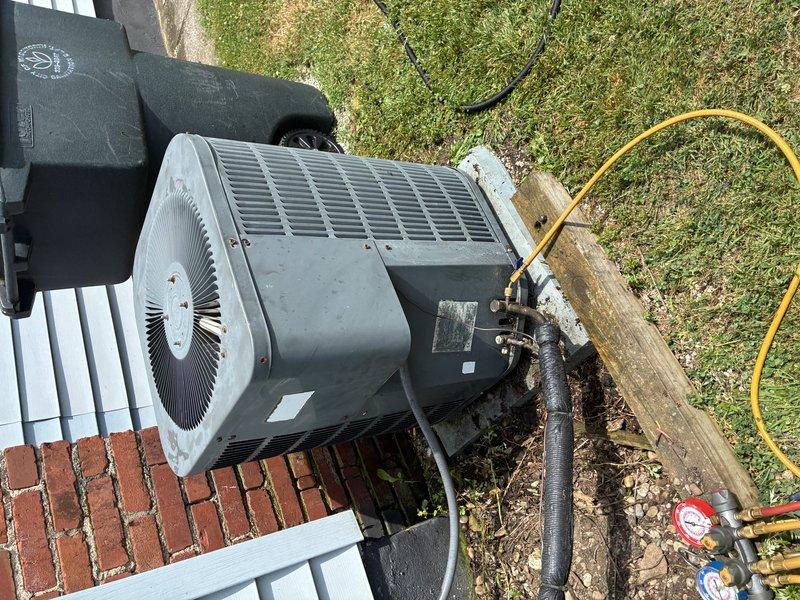 Responded to no cooling complaint on 10-year-old residential air conditioning system. Upon arrival, performed diagnostic evaluation of outdoor condenser unit using manifold gauges to assess refrigerant pressures and system performance. Connected service gauges to unit and identified operational issue preventing proper cooling function. Completed necessary repairs to restore system to normal operation and verified proper airflow through condenser coil and fan assembly.