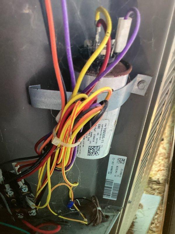 Responded to no cooling complaint on 8-year-old air conditioning system. Performed electrical diagnostics using digital multimeter to test voltage and continuity at control board and component connections. Inspected wiring harness, terminal connections, and capacitor within unit compartment. All electrical values tested within normal operating parameters and components found to be functioning properly.