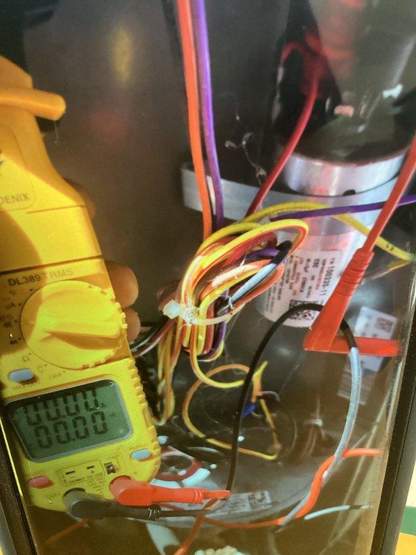 Responded to no cooling complaint on 8-year-old air conditioning system. Performed electrical diagnostics using digital multimeter to test voltage and continuity at control board and component connections. Inspected wiring harness, terminal connections, and capacitor within unit compartment. All electrical values tested within normal operating parameters and components found to be functioning properly.