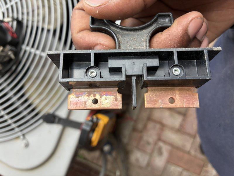 Completed comprehensive cooling maintenance on a Lennox unit as part of an MVP maintenance agreement. Performed standard AC tune-up procedures including inspection of electrical components, contactor assembly, and disconnect mechanism. Noted oxidation and blue-green patina on copper bus bars within the electrical disconnect, indicating moisture exposure over time. Inspected terminal block connections with multiple wire terminations, observing age-related discoloration and dust accumulation on wiring and components. System was operational at time of service and all connections were secure. Documented equipment condition through photographs for maintenance records.