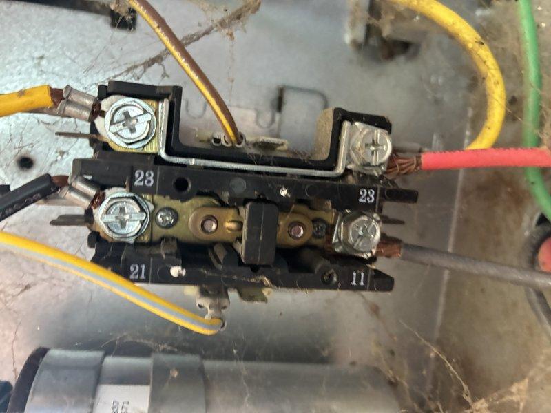 Completed comprehensive cooling maintenance on a Lennox unit as part of an MVP maintenance agreement. Performed standard AC tune-up procedures including inspection of electrical components, contactor assembly, and disconnect mechanism. Noted oxidation and blue-green patina on copper bus bars within the electrical disconnect, indicating moisture exposure over time. Inspected terminal block connections with multiple wire terminations, observing age-related discoloration and dust accumulation on wiring and components. System was operational at time of service and all connections were secure. Documented equipment condition through photographs for maintenance records.