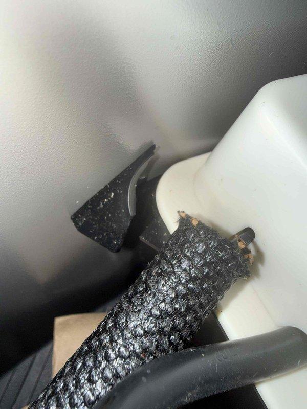 Responded to service call regarding water overflow from condensate drain system. Upon inspection, found deteriorated drain line insulation and potential condensate drainage issues at the evaporator coil assembly. Documented system conditions with photos showing drain connections and insulated refrigerant lines with visible wear. Customer inquired about warranty coverage for repairs.